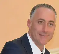 Emilio Caligiuri, Amministratore Salumificio Menotti