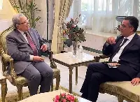 Tunisian Foreign minister Othman Jerandi (left) welcomes Abdellatif Ghedira, executive director of the international olive oil Council (IOC)